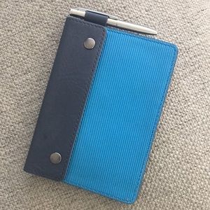 Fossil passport holder with attached pen